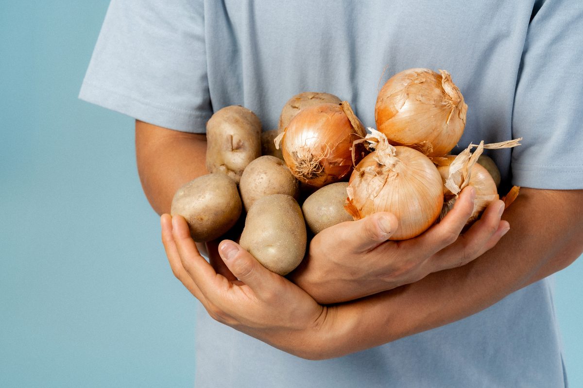 Hands holding fresh onions